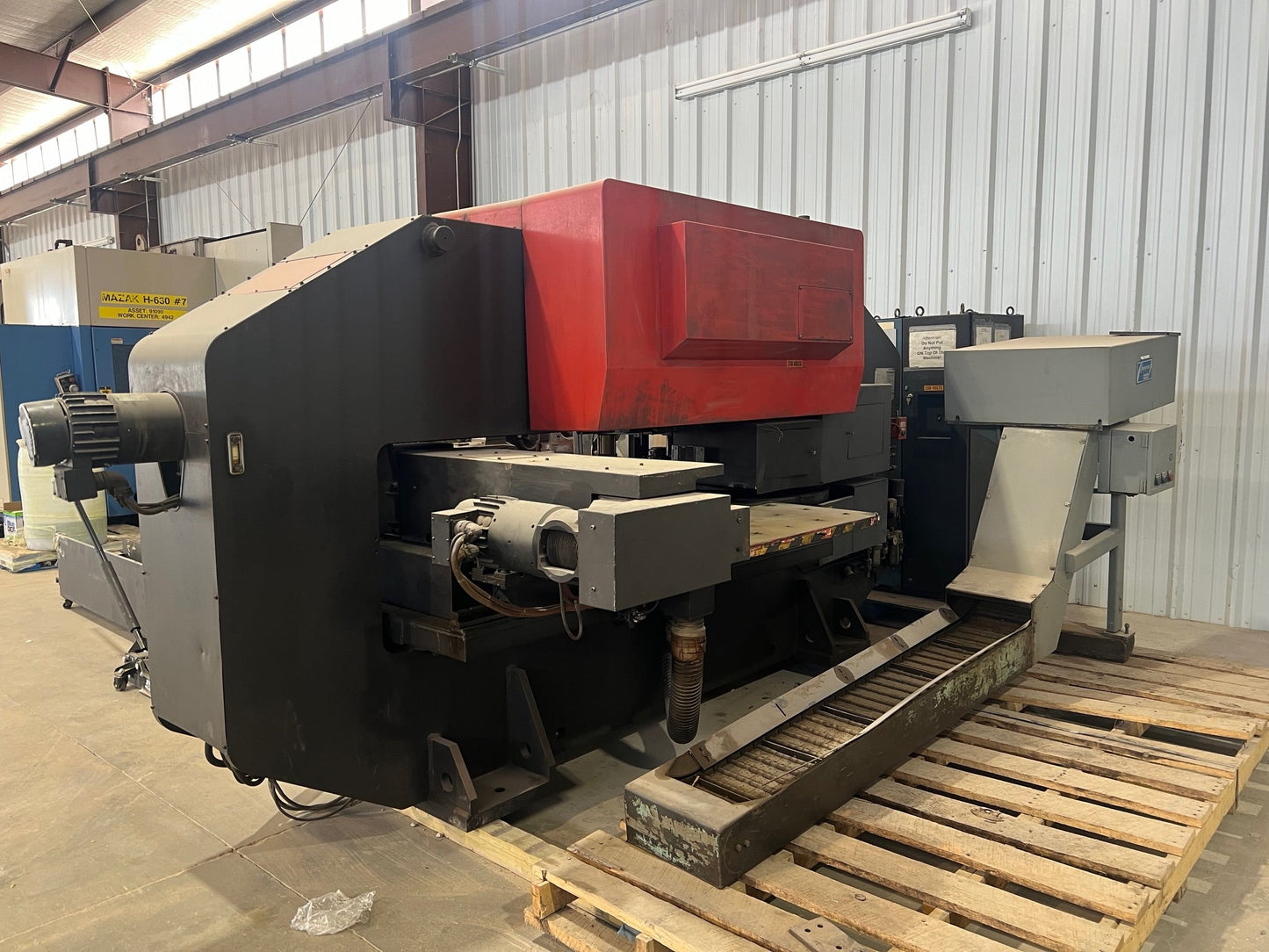 A Pega 344 Hole Puncher, featuring a compact design, precision punching capabilities, and intuitive controls for efficient hole punching tasks in various materials.