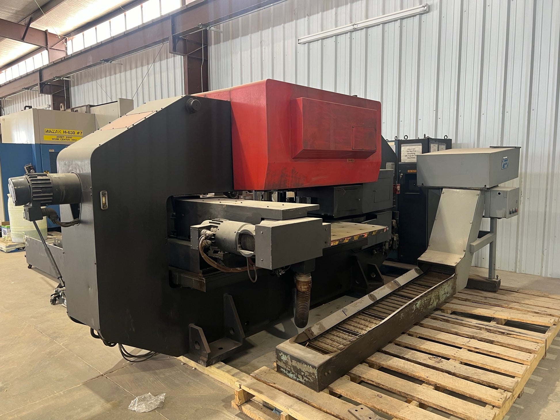 A Pega 344 Hole Puncher, featuring a compact design, precision punching capabilities, and intuitive controls for efficient hole punching tasks in various materials.