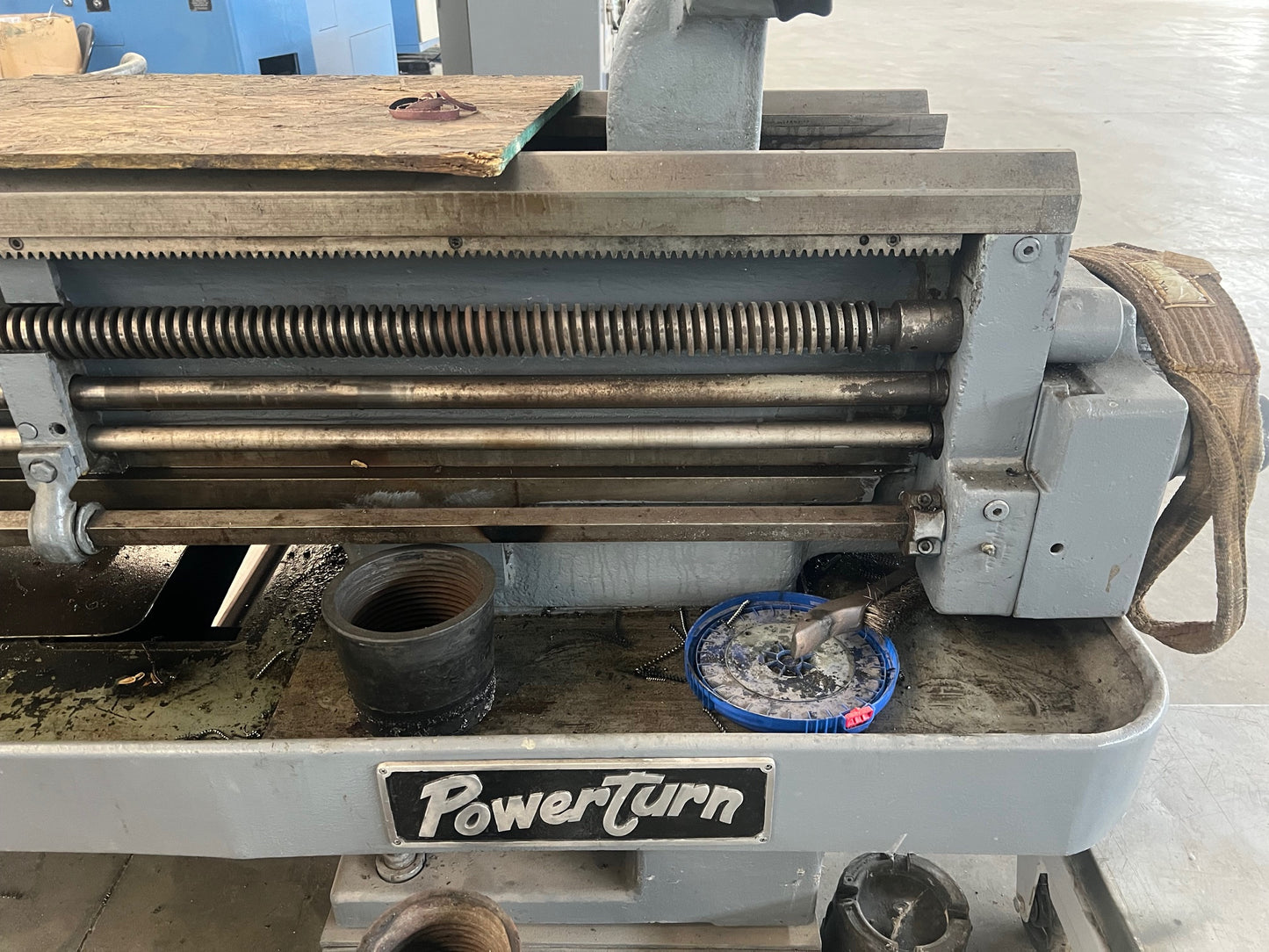 An industrial-sized Lodge and Shipley Lathe, a heavy-duty machinery with metallic components, gears, and control panels, ready for manufacturing processes.